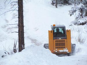 Ploughing the road at Ginty Creek near Kleena Kleene