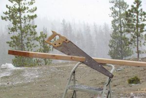 sawing the sides to the attic steps at Ginty Creek.