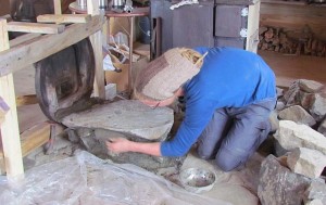 Mogens cementing the base for the stone oven