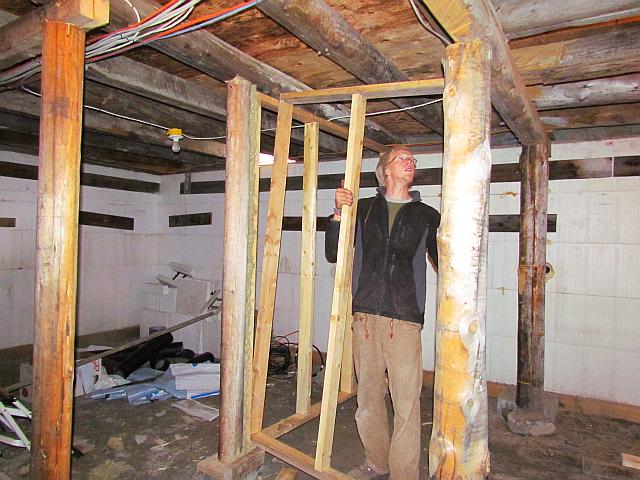 Mogens framing a room in the basement at Ginty Creek