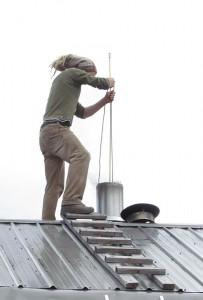 mogens sweeping the chimney at Ginty Creek