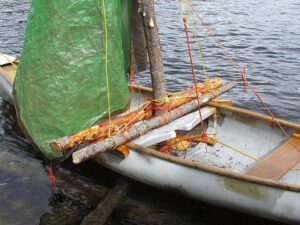 rigging a sail on a canoe