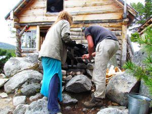 raking the ashes out of Nuk Tessli's outdoor stone oven.