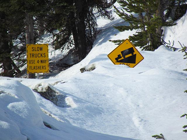 buried road signs on Highway 20 at Heckman Pass