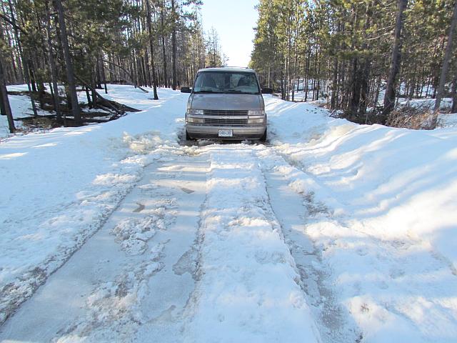 van in frozen puddle